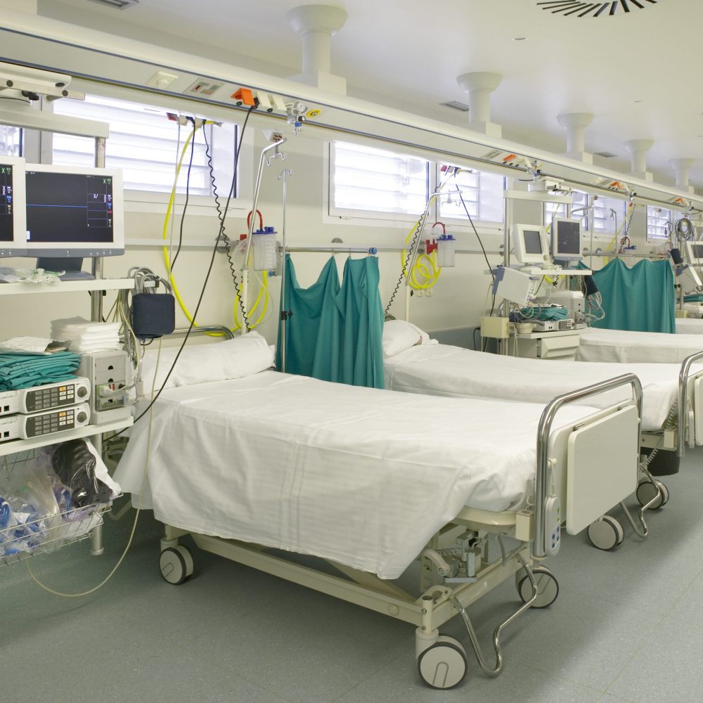 Hospital intensive care unit area with beds equipment. Health center